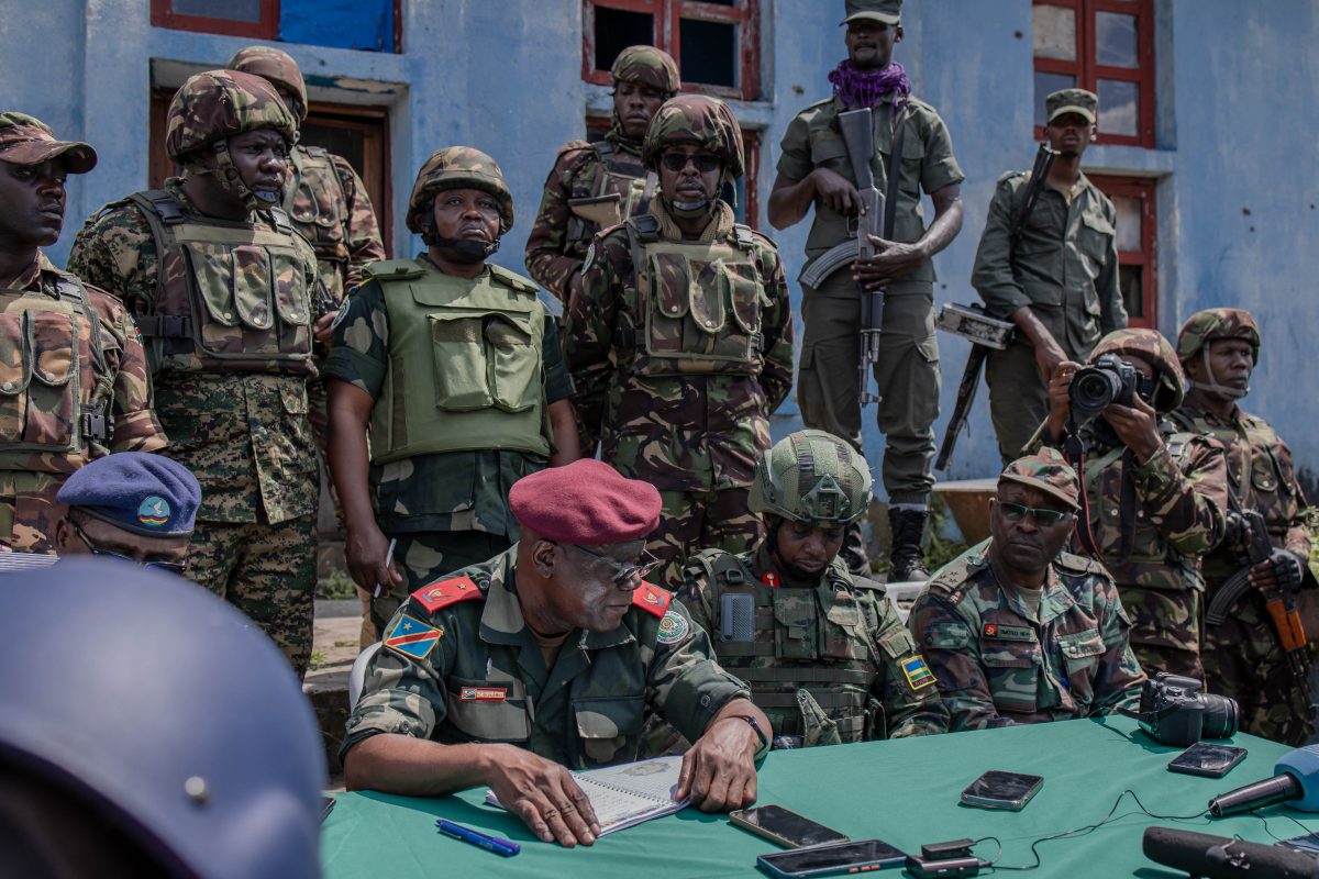 East African Regional Force (EACRF) officials meet with M23 rebels during the handover ceremony at Rumangabo camp in eastern Democratic Republic of Congo, January 6, 2023