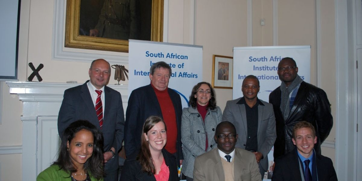 Image: (Back from left to right) Dr. Holger Dix, Bobby Godsell, Elizabeth Sidiropoulos, MacIntosh Polela, Daniel Makokera. (Bottom left to right) SAIIA-KAS Interns: Anabel Tennassie, Cayley Bowland, Clarence Siziba and Christopher Wood