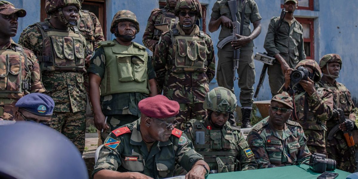 East African Regional Force (EACRF) officials meet with M23 rebels during the handover ceremony at Rumangabo camp in eastern Democratic Republic of Congo, January 6, 2023