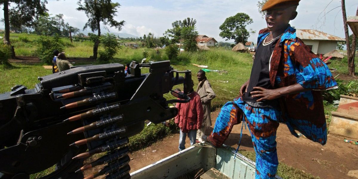 A child fighter at a military camp in Bunia, north-eastern DRC, in 2003. Image: Getty, Eric Feferberg/AFP
