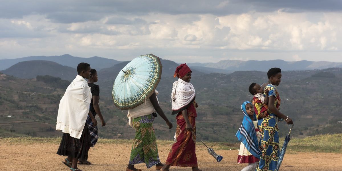 Kayumbu, Rwanda: A group of women walking in the Rwandan countryside. Rwanda is the most densely populated country in Africa. There are an estimated 352 people/square kilometer. Image: Getty, William Campbell-Corbis
