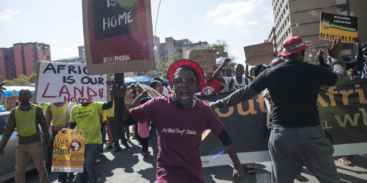 Hundreds of protesters carry placards as they march during an anti-xenophobia demonstration in Johannesburg, South Africa on April 23, 2015. Image:Getty, Ihsaan Haffejee