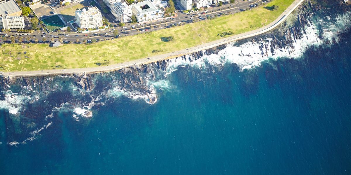 Aerial shot of the urban coastline of Cape Town, South Africa. Image: Getty, AnneBaek