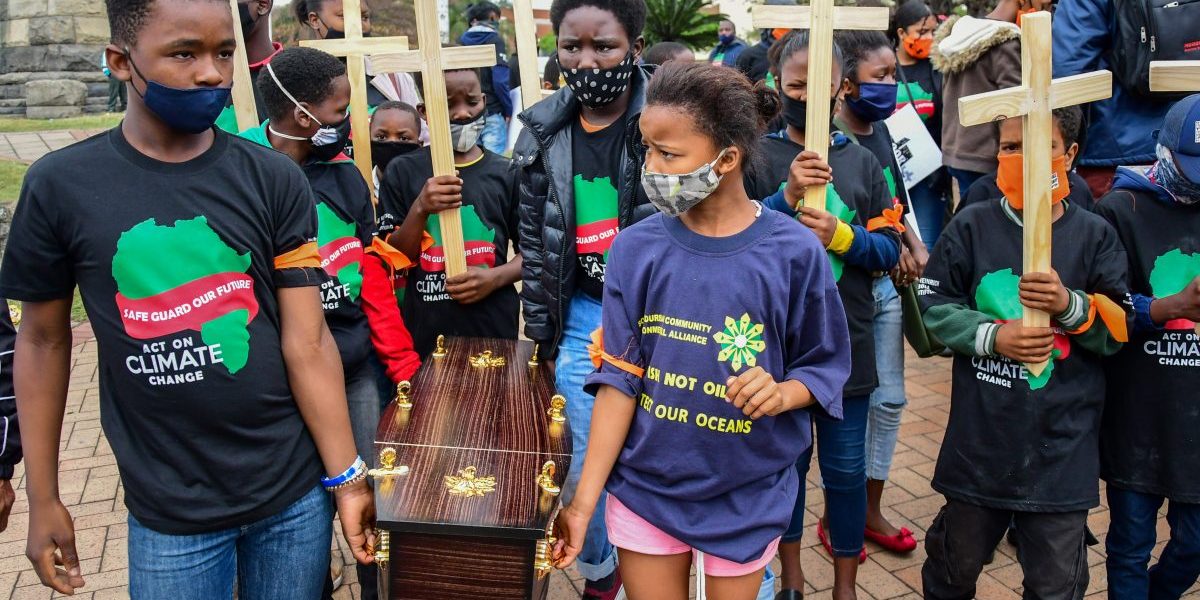 Children carrying a coffin and crosses during the Global Climate Strike March on October 02, 2020 in Durban, South Africa. Image: Getty, Darren Stewart