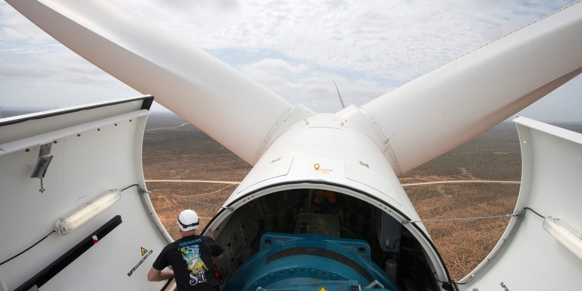 Engineer Lars Birkmann looks on from a wind turbine at the Sere Wind farm, close to Vredendal, about 350 km from Cape Town. Image: Getty, Rodger Bosch/AFP