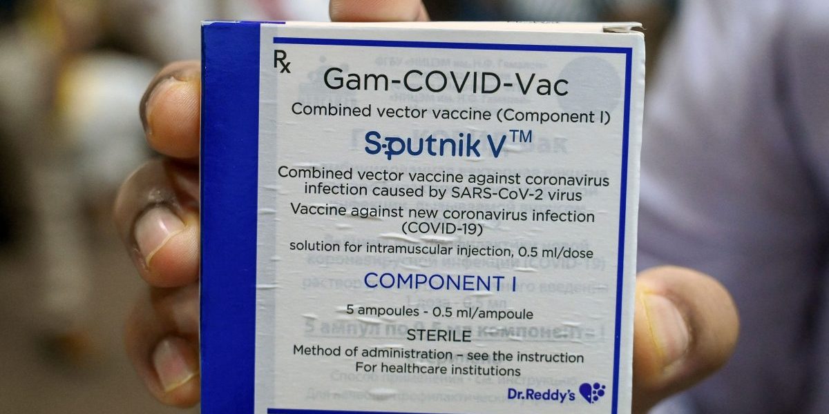 A health worker holds for show a box containing vials of the Sputnik vaccine against the Covid-19 coronavirus is seen at Indraprastha Apollo hospital in New Delhi. Image: Getty, Prakash Singh/AFP