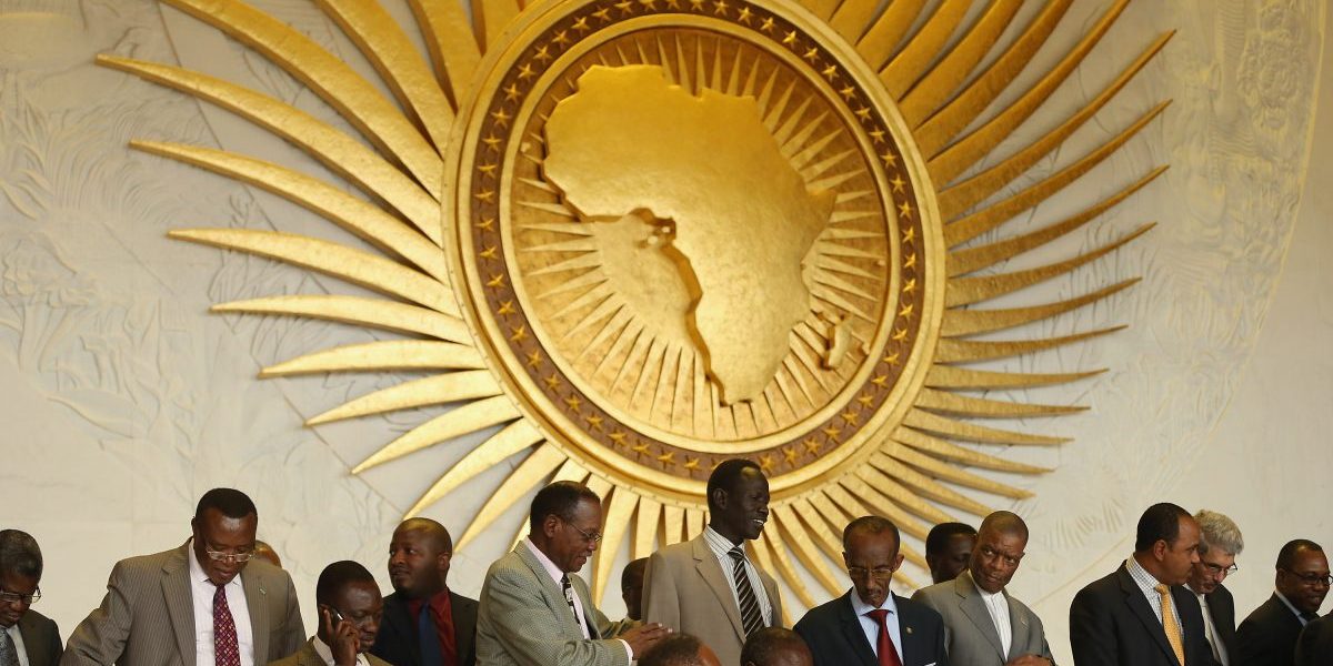 Delegates arrange themselves for a group picture during a visit by the German president at the headquarters of the African Union (AU) in Addis Ababa. Image: Getty, Sean Gallup