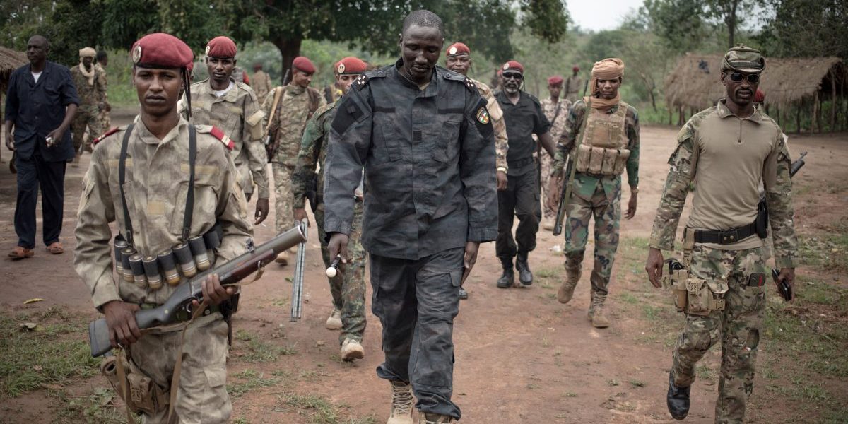 The leader of Union for Peace in Central African Republic (UPC) armed group, Ali Darassa (C), walks with his security forces, in the city of Bokolobo. Image: Getty, Florent Vergnes / AFP