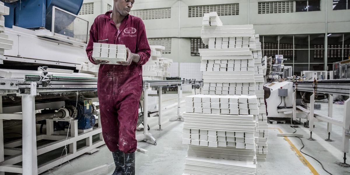 A worker stacks shaped Msafi washing soap bars ready for packaging on the production line at the Bidco Africa Ltd. factory in Thika, Kenya on Friday, Sept. 14, 2018. Image: Getty,  Luis Tato/Bloomberg