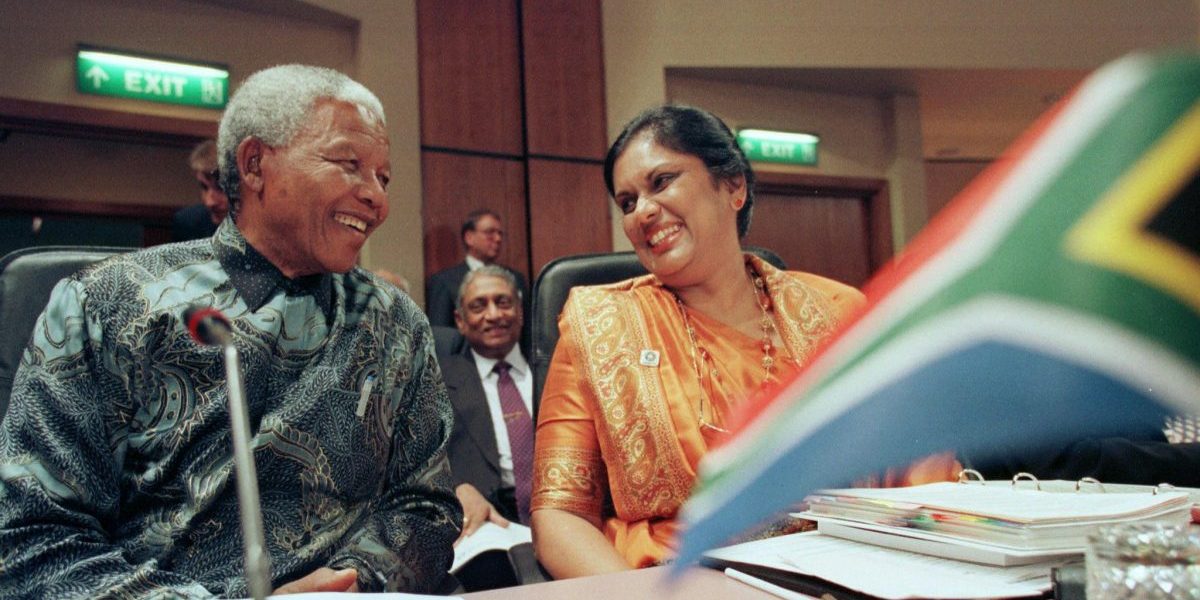 24 October 1997: South African President Nelson Mandela and Sri Lankan President Chandrika Bandaranaike Kumaratunga laugh together before the first session of the Commonwealth Heads of Government Meeting. Image: Getty, AFP / Kevin Lamarque