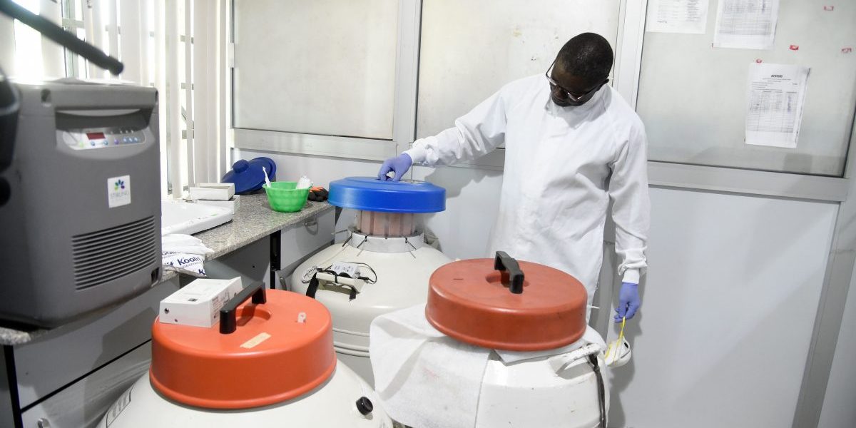 Professor Christian Happi, the director of the African Centre of Excellence for Genomics of Infectious Diseases (ACEGID), opens a tank in the laboratory during an inspection of facility at the centre located at the Redeemers University in Ede, southwestern Nigeria. Image: Getty, Pius Utomi Ekpei /AFP