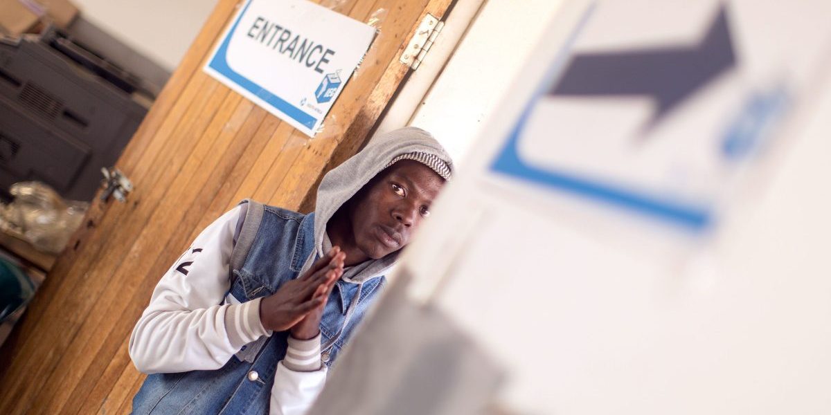 An Independent Electoral Commission (IEC) official stands at a polling station during the municipal elections in Wembezi township near Estcourt, in KwaZulu-Natal Province. Image: Getty, Rajesh Jantilal/AFP