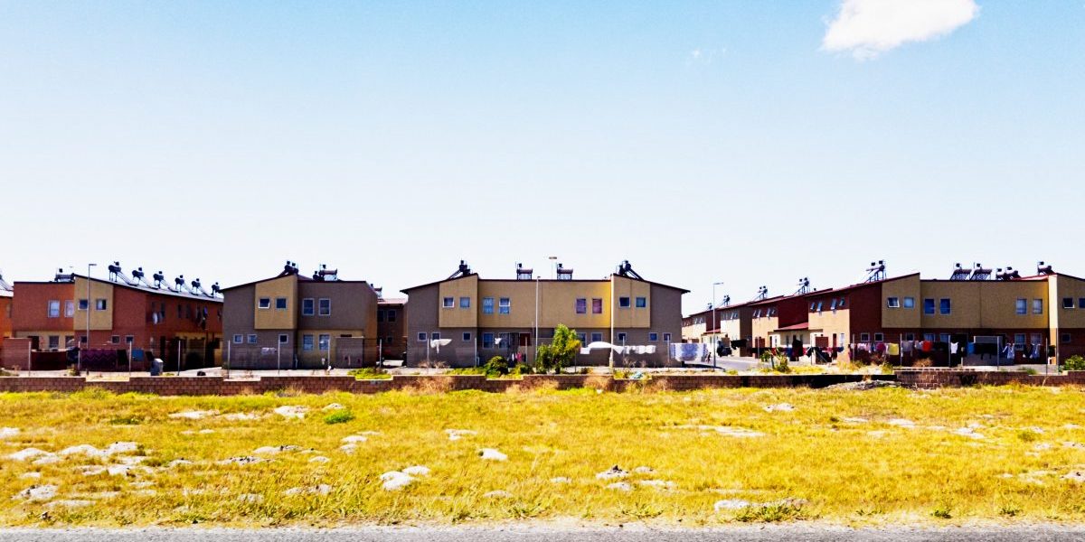 Government-built low-income apartment block with solar water heaters on rooftops. Image: Getty, RapidEye