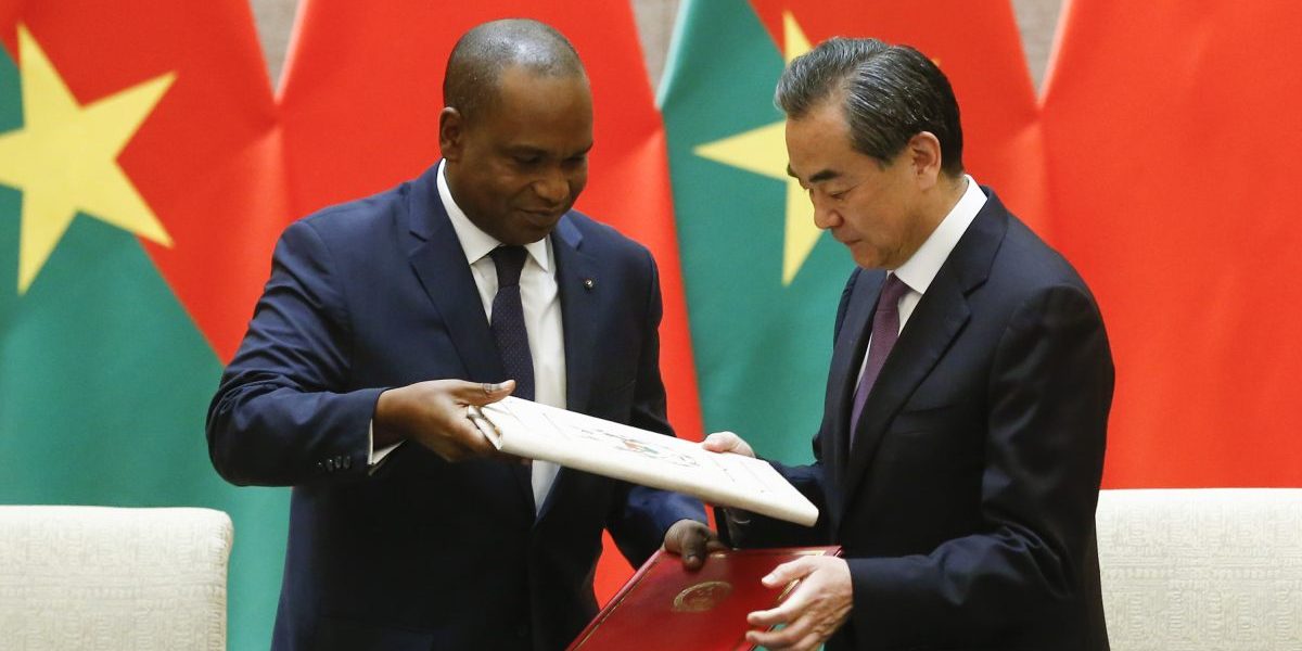 China's Foreign Minister Wang Yi and Burkina Faso Foreign Minister Alpha Barry attend a signing ceremony establishing diplomatic relations between the two countries on May 26, 2018 in Beijing, China. Image: Getty, Thomas Peter