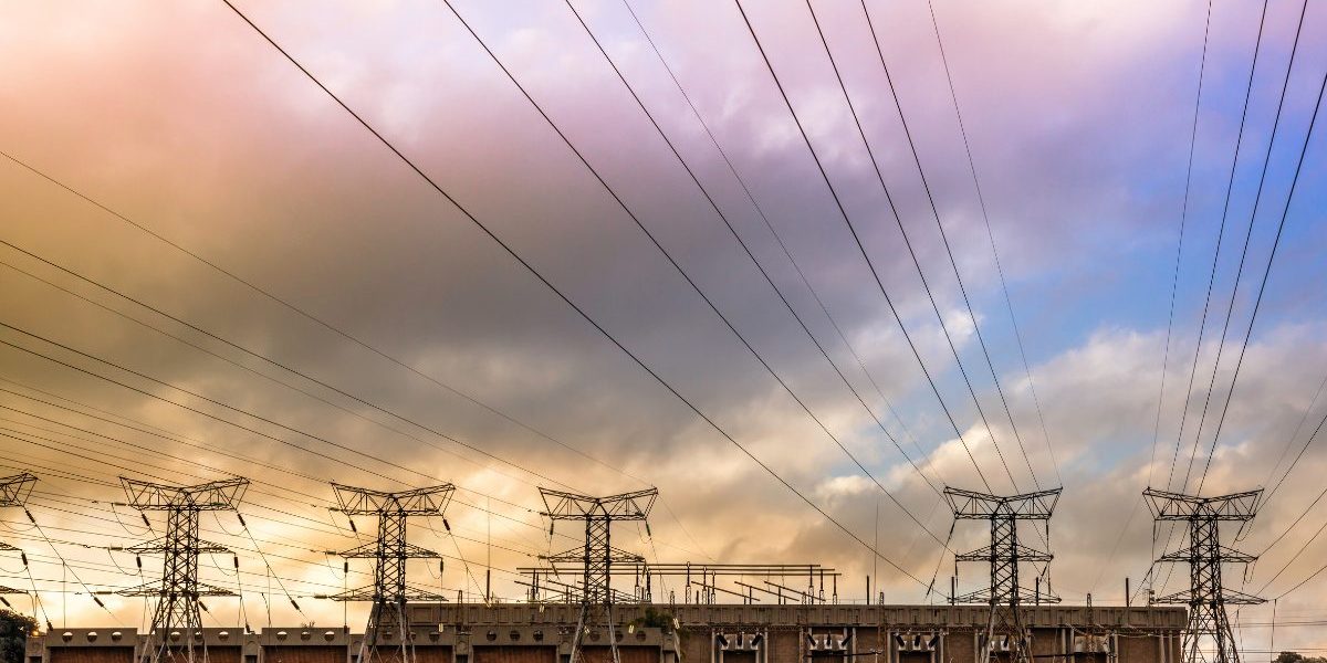 Electricity pylons from a substation at sunset. Image: Getty, THE GIFT 777