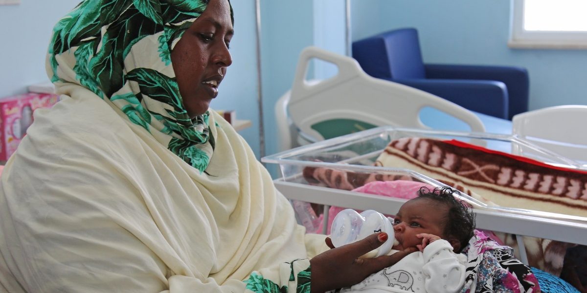A Somalian woman takes care of her baby at a Turkish hospital in Mogadishu. Image: Getty, Sadak Mohamed